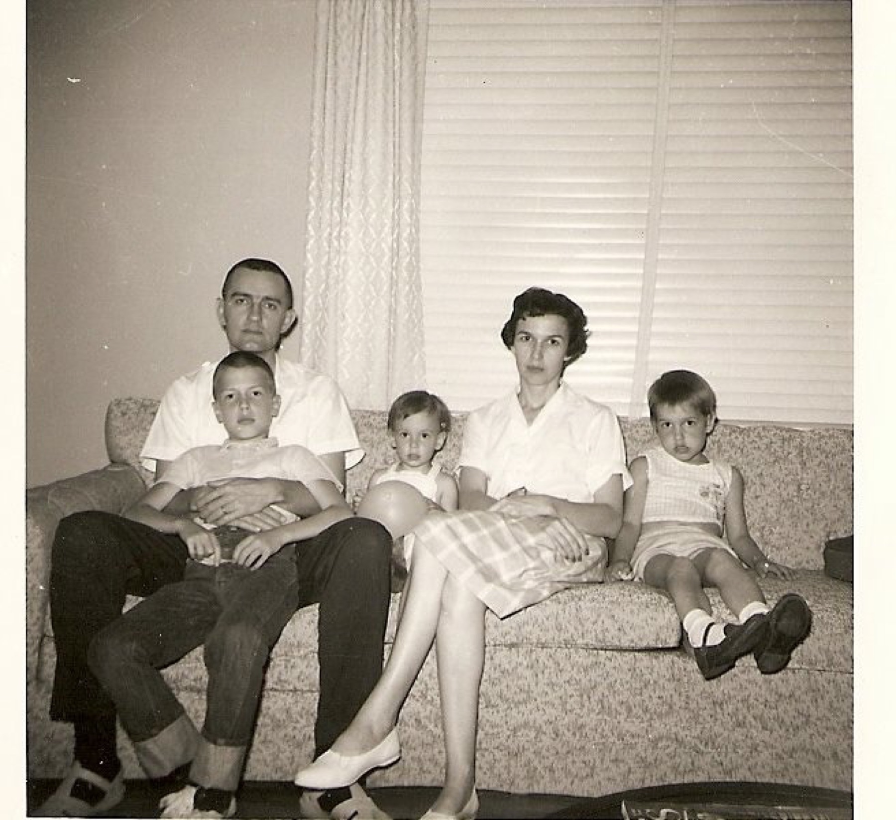 The Holley family on the couch in the 1960s.